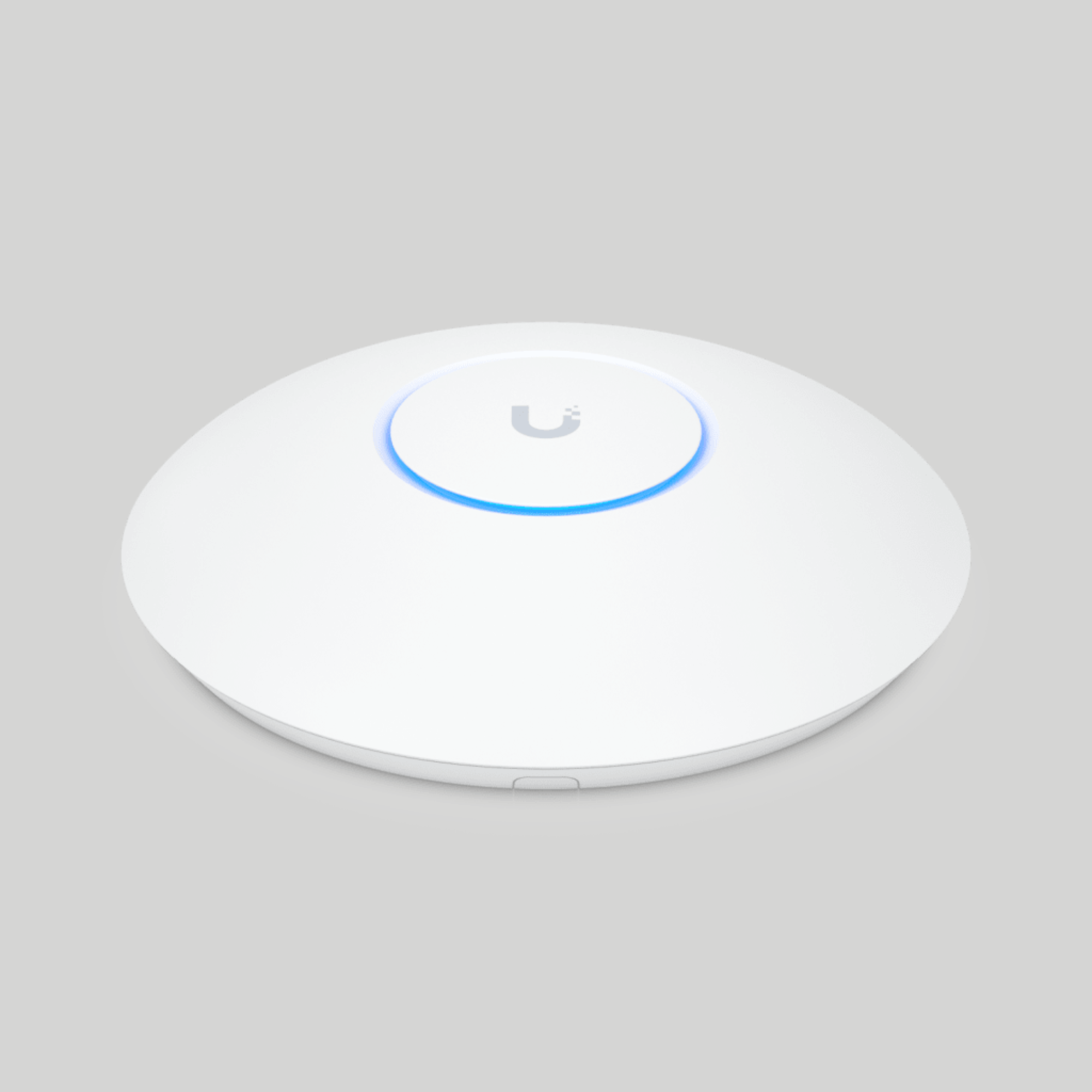AP UniFi U7 Pro WiFi 7 blanco con luz LED azul, diseño compacto para oficinas y call centers