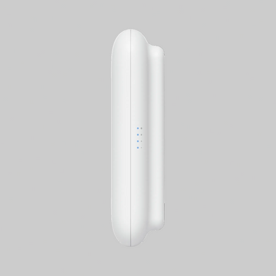 Perfil lateral del AP UniFi UK-Ultra blanco con indicadores LED azules y cuerpo delgado para montaje